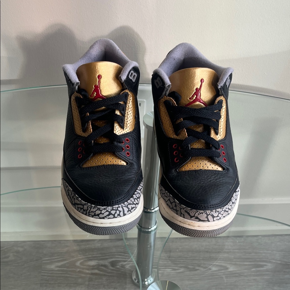 Women’s Air Jordan Black / Gold / Marble Print Sneakers.